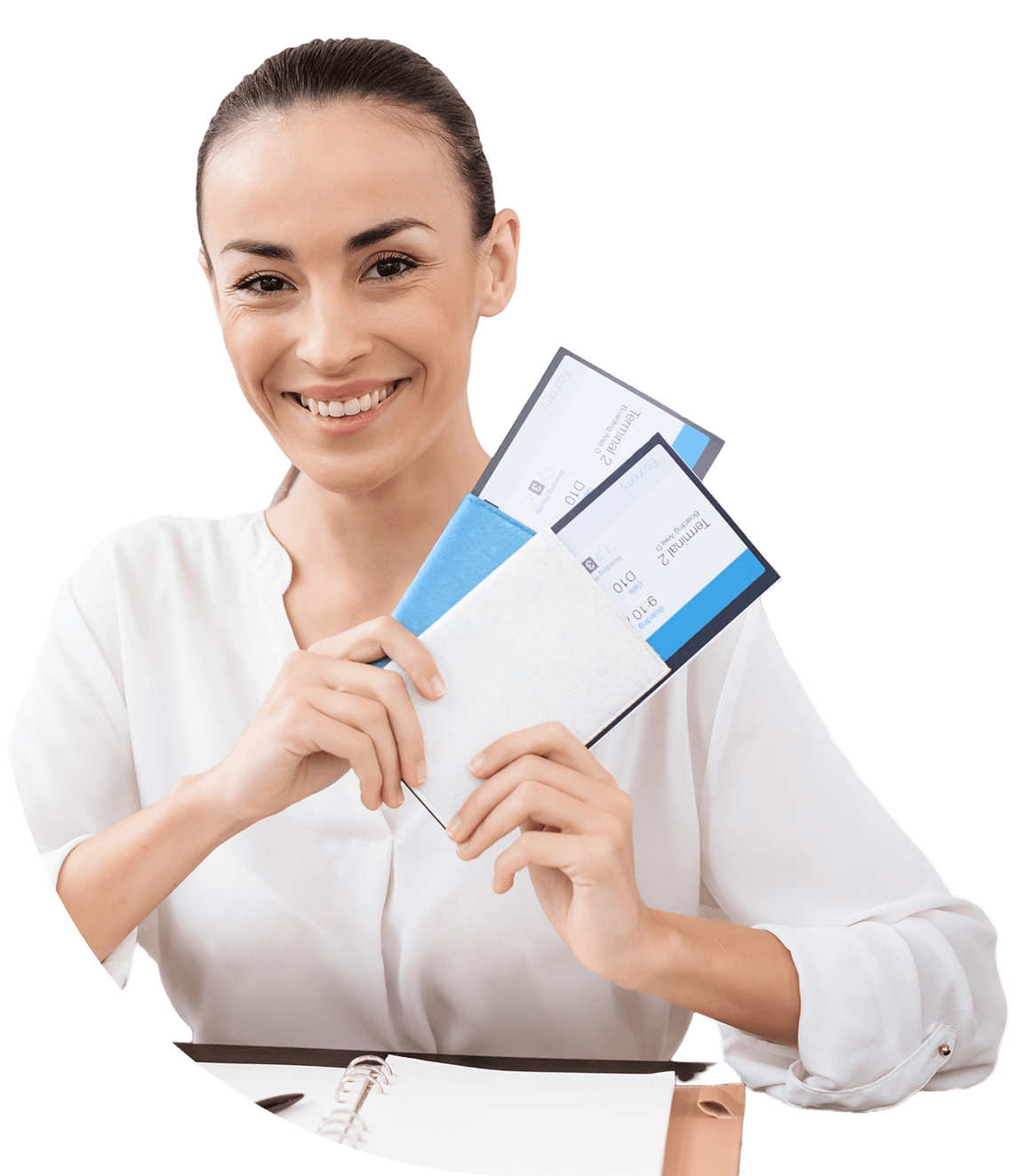 Smiling woman holding travel documents and tickets.